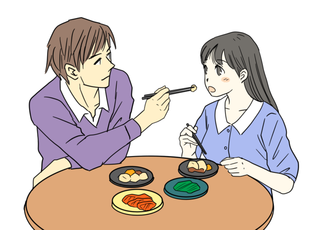 食事するカップル