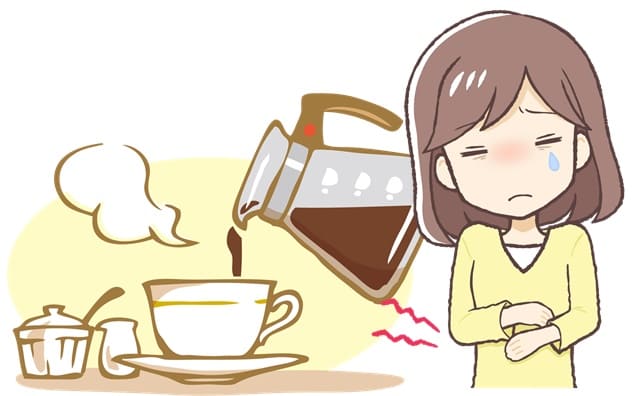 コーヒーとお腹が痛くなった女性